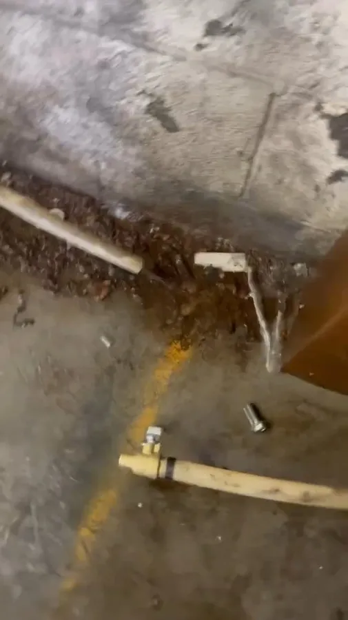 Exterior water service line repair with pipe exposed in soil during burst pipe repair in surprise, az