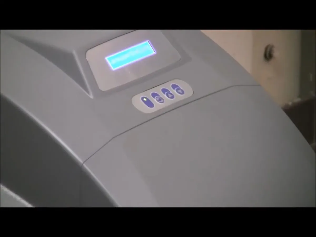 Whole-house water softener with control valve and resin tank during plumbing service in El Mirage