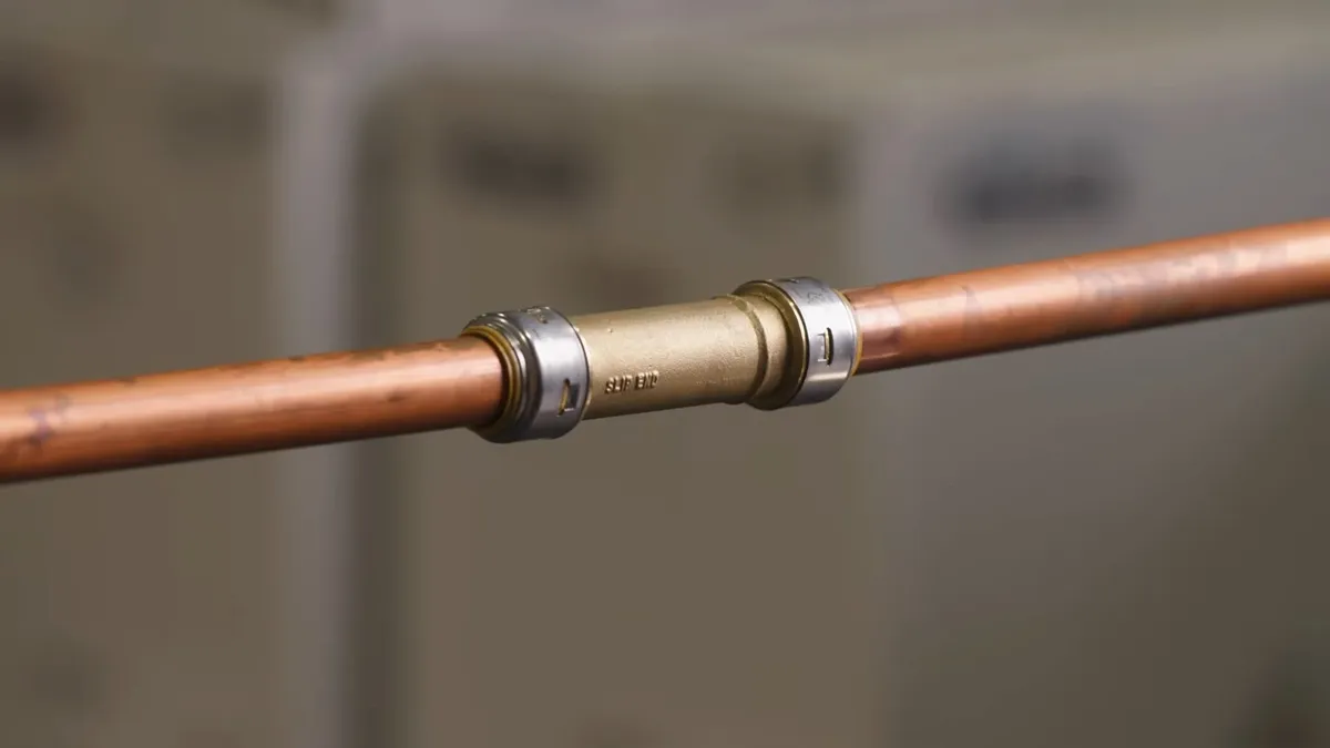 New PEX and copper pipe connections being installed during a repipe during frozen pipe repair near surprise, az
