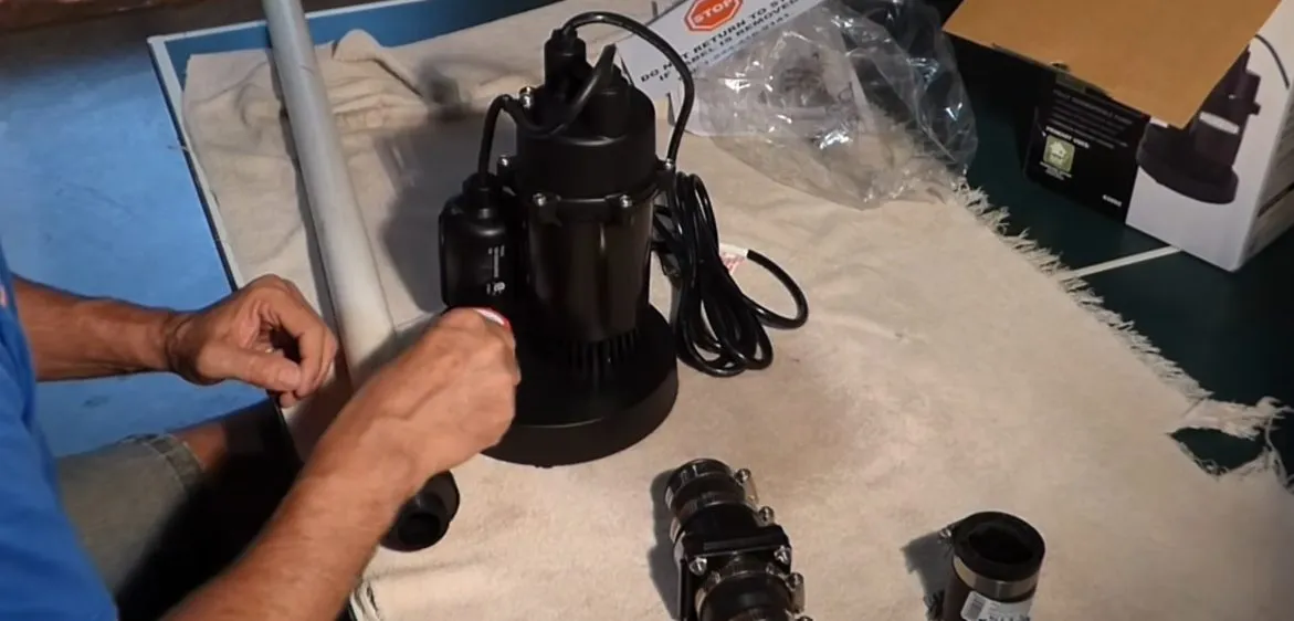 Sump pump basin and pump components being fitted near a foundation during plumbing service in Marley Park, Surprise, AZ