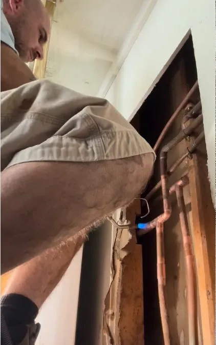 Technician using leak detection equipment around hidden plumbing during plumbing service in Mountain Vista Ranch, Surprise, AZ