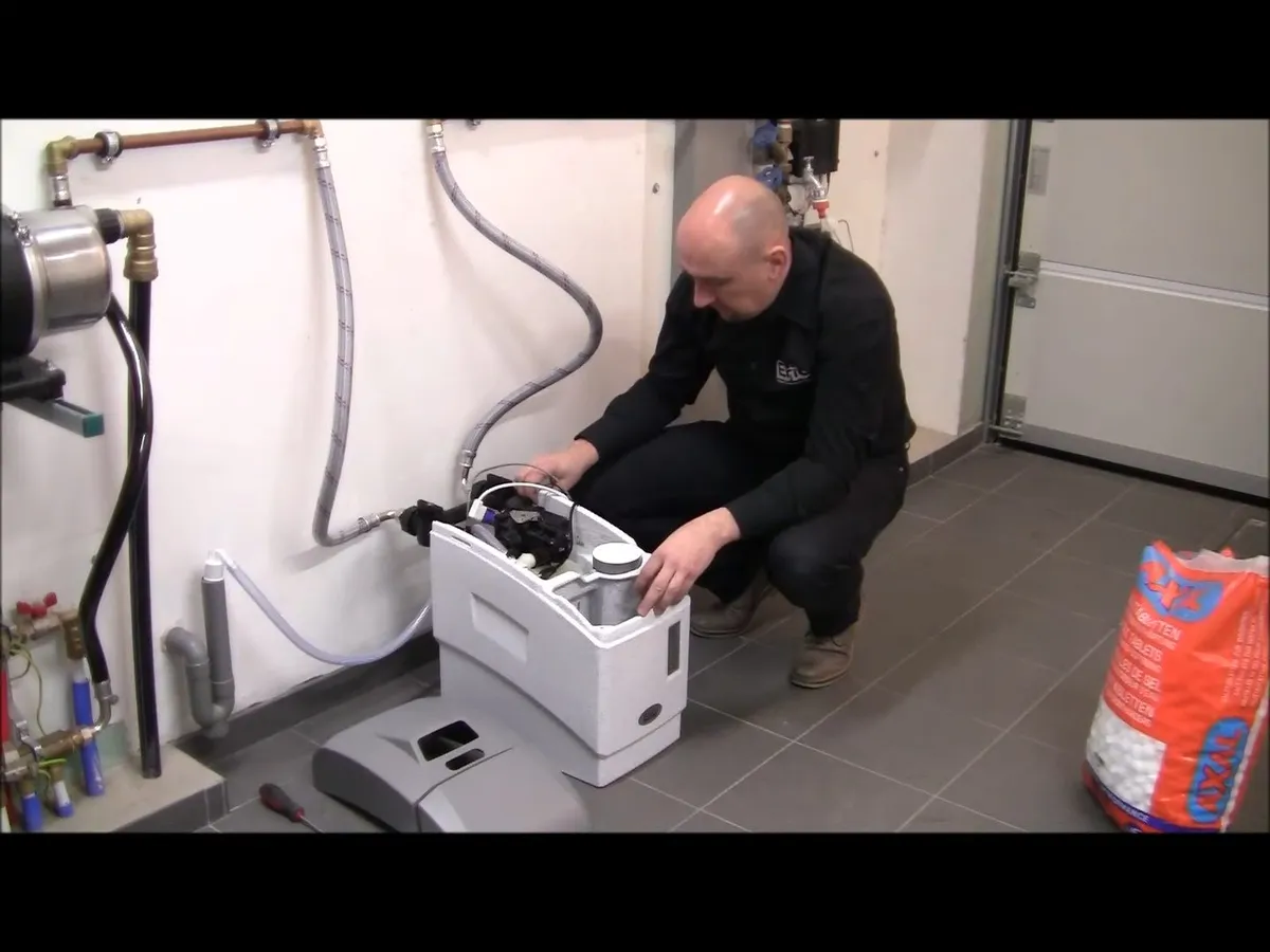 Whole-house water softener with control valve and resin tank illustrating moving to surprise az: plumbing things to know first