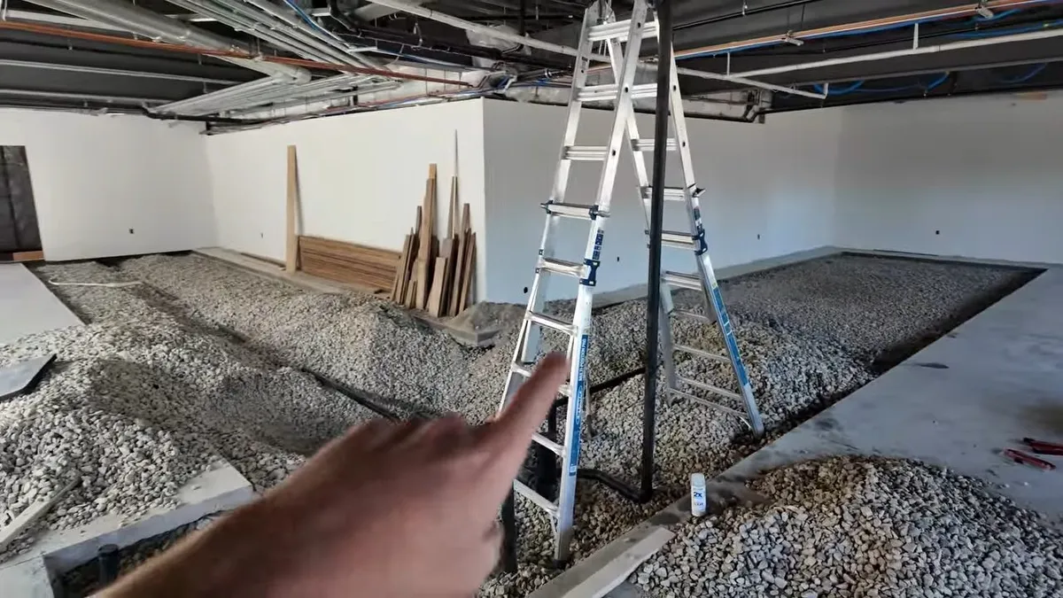 Commercial plumbing work area with open space, piping, and building materials illustrating plumbing defects in new surprise az construction homes