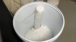 Open water softener brine tank filled with salt pellets during plumbing service in Prasada, Surprise, AZ