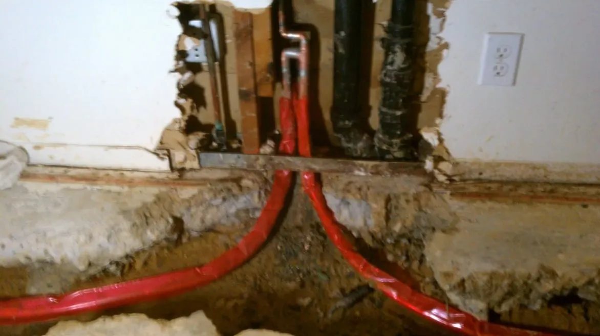 New PEX and copper pipe connections being installed during a repipe during whole-home repiping in surprise, az, with focus on repipe new pex copper pipe