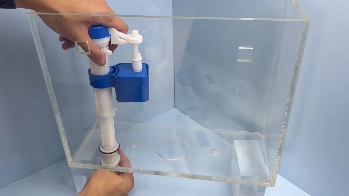 Toilet tank repair parts with fill valve and flapper components during toilet repair & replacement in surprise, az