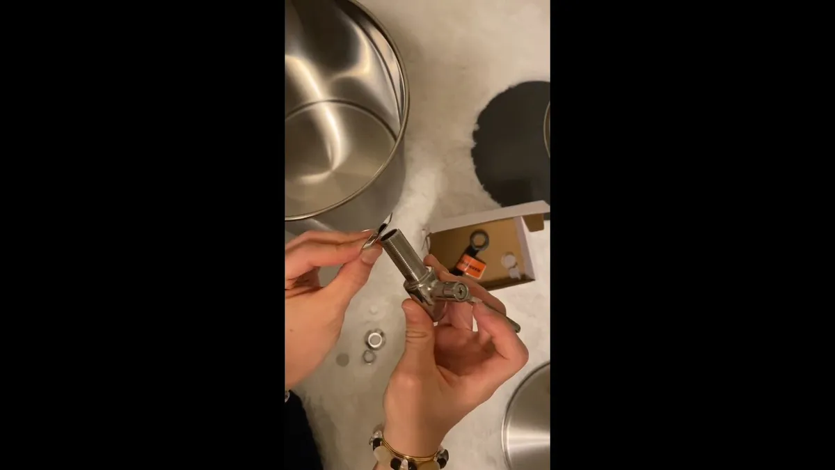Gas line valve and water heater piping connection being checked during plumbing service in Waddell