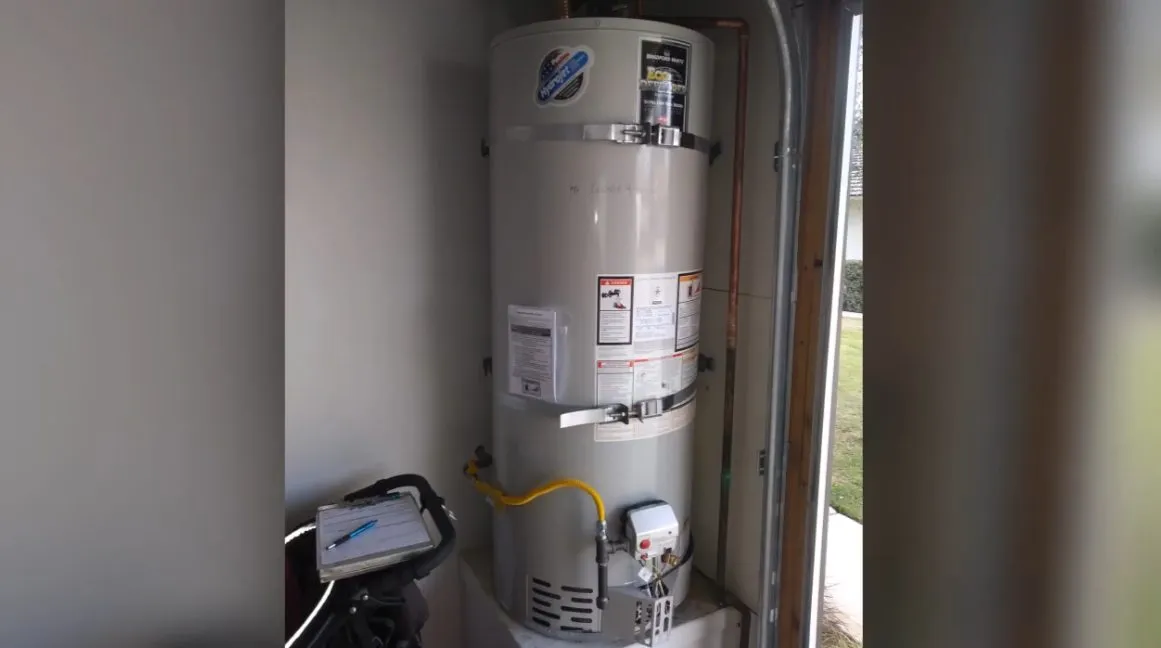 Tank water heater with nearby valves, venting, and supply connections illustrating water heater replacement in sun city grand az guide