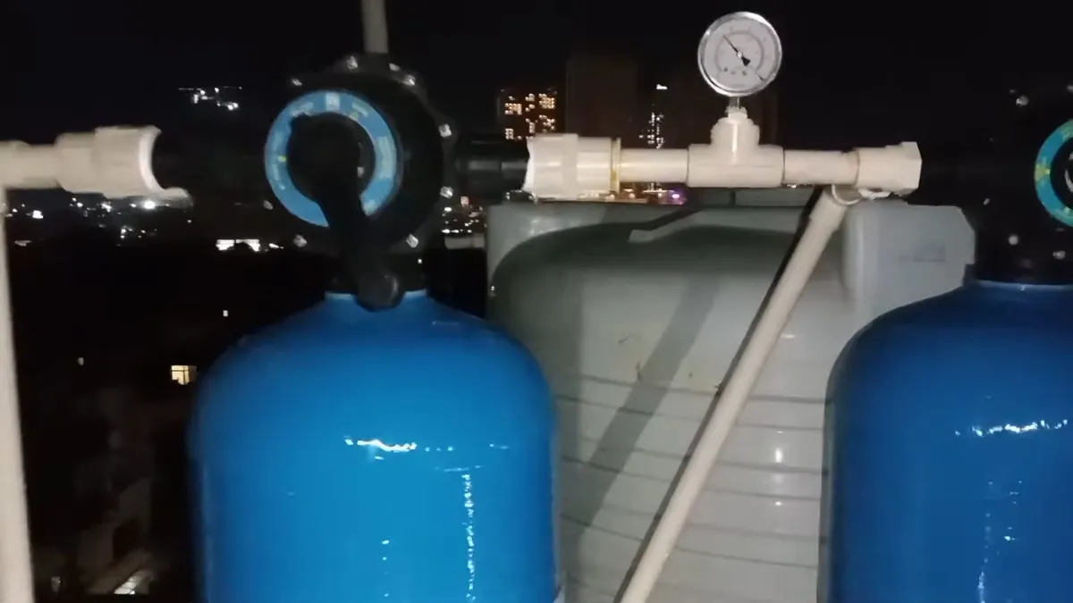 Whole-house water softener with control valve and resin tank illustrating water softener sizing guide for surprise, az homes, with focus on bradbury whole water softener control